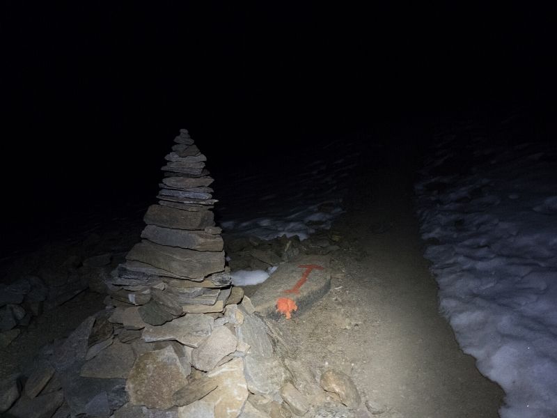 rock-cairn-at-night-alps-intext