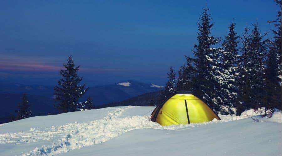 tent on snowy hillside - In Text