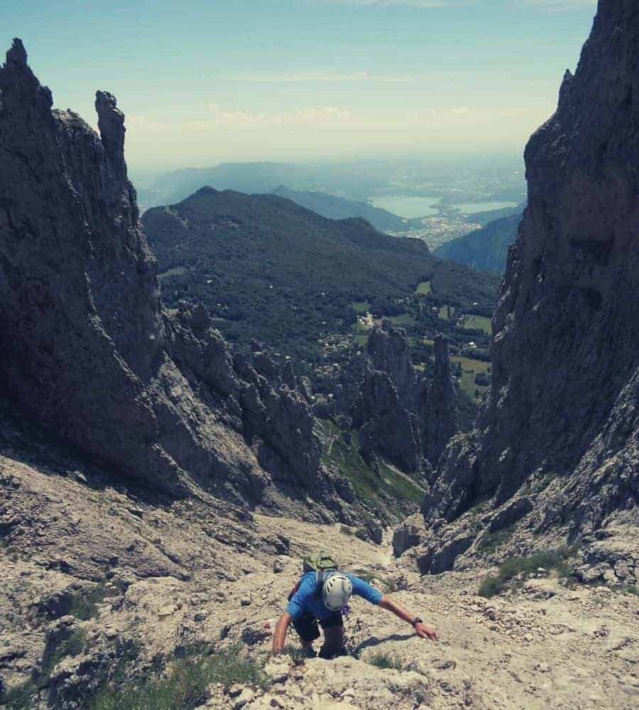 Climber climbing mountainside