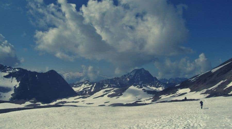 hiker cairn snowfield intext