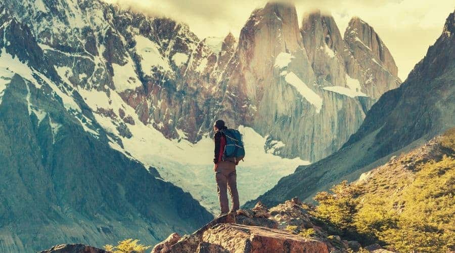 backpacker looks out over mountains