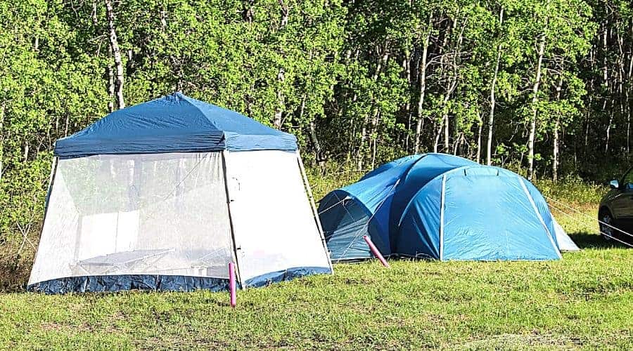 Camping with a tent and having a bug screen to retreat to - In Text