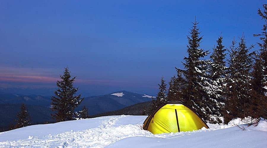 tent on snowy hillside - In Text