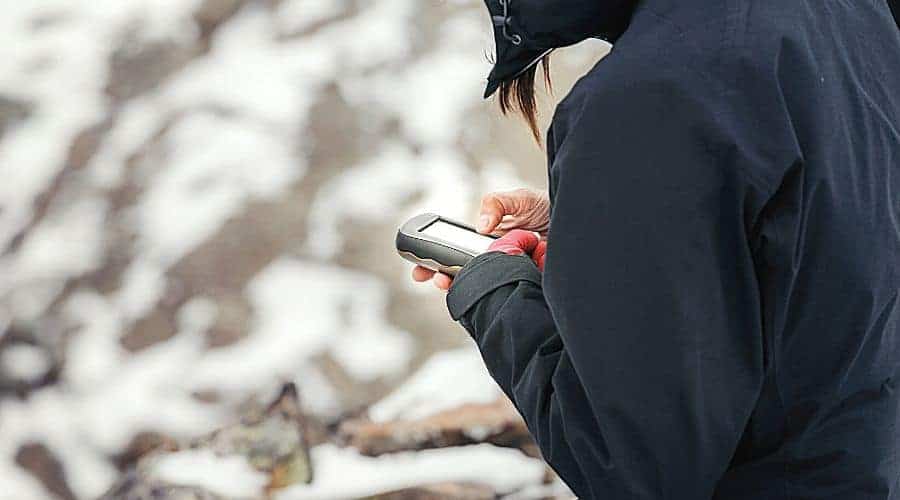 Woman Holding GPS unit - In Text