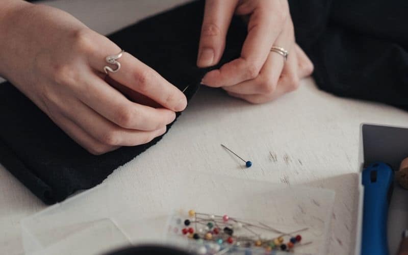 Woman hand sewing