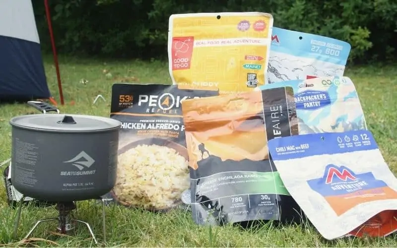 Backpacking stove and backpacking meals outside tent