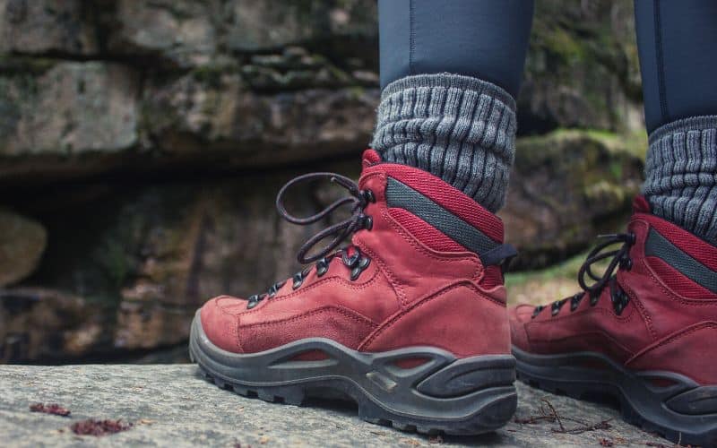 Hiker wearing red hiking boots, socks and leggings