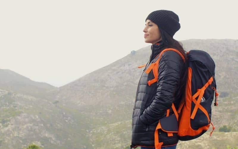 female hiker wearing down jacket