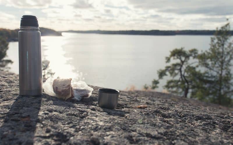 thermos flask overlooking lake