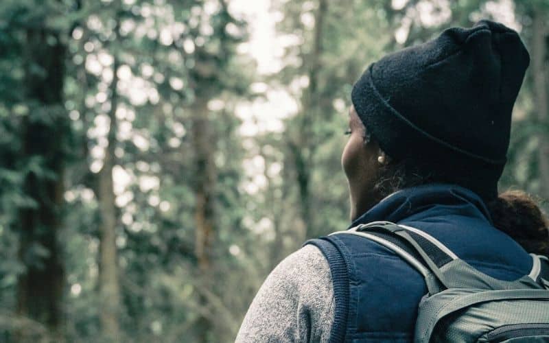 Hiker in forest wearing a cuffed beanie