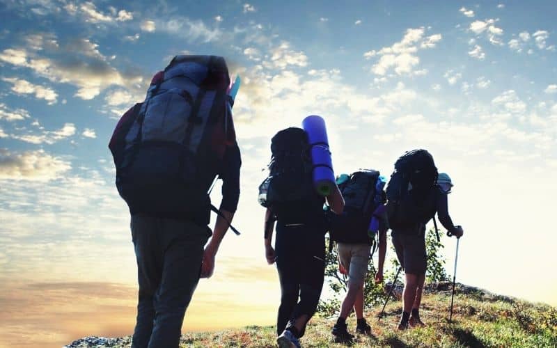 Backpackers hiking with large backpacks