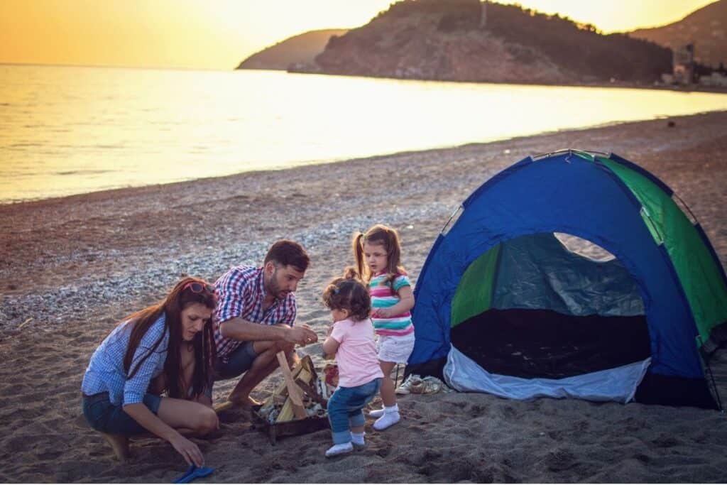 Family camping on a beach
