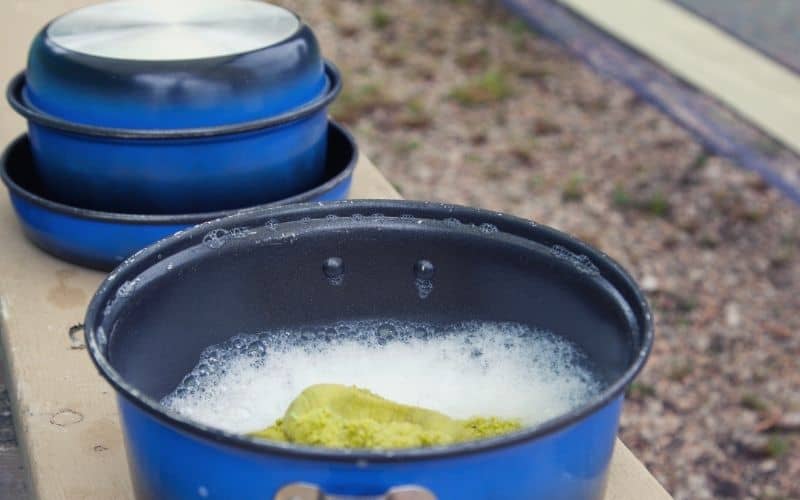 Camping pots filled with soapy water