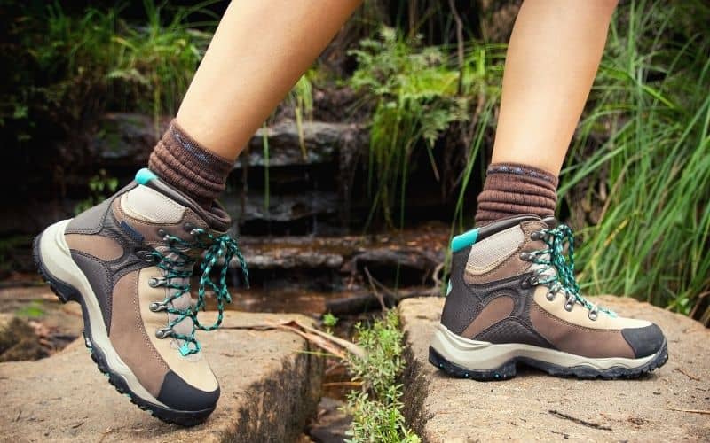 Hiker wearing long hiking socks and boots