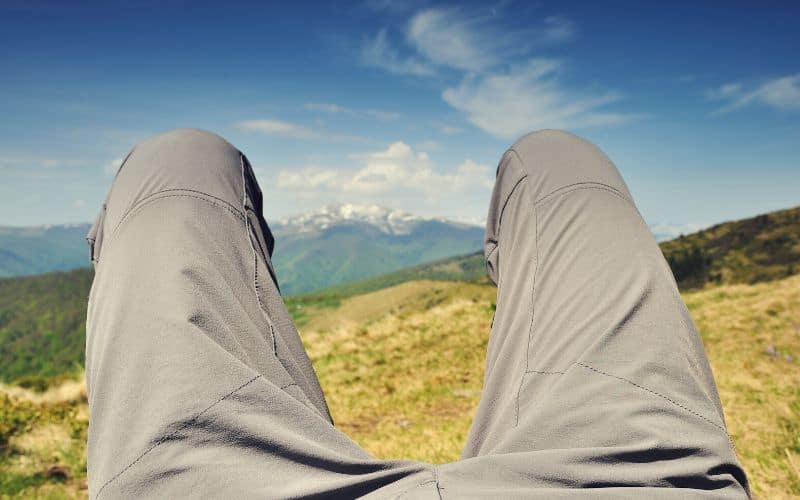 Hiker wearing mountaineering pants