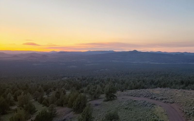 Panoramic views of lava flows, cinder cones, and desert landscape of the Fort Rock and Christmas Valley area round Green Mountain Campground