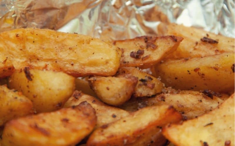 Seasoned potato wedges in foil