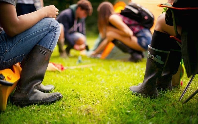 Teenagers setting up a tent