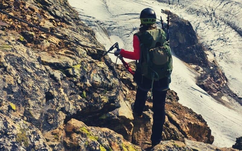 female mountaineering making a descent