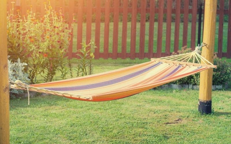 hammock hanging in garden from two posts