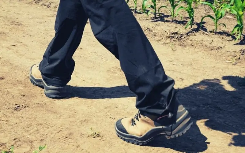 hiker wearing dark hiking pants with draw string bottoms