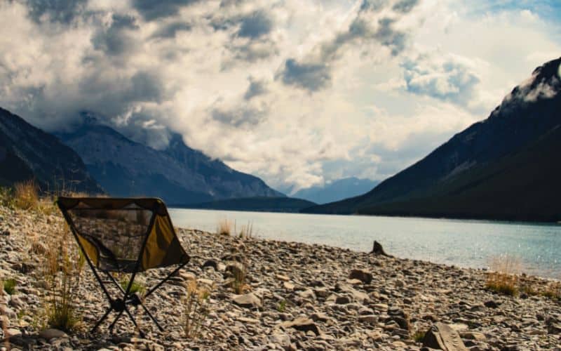 Backpacking chair in front of a lake