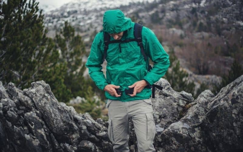 hiker wearing thin water resistant jacket