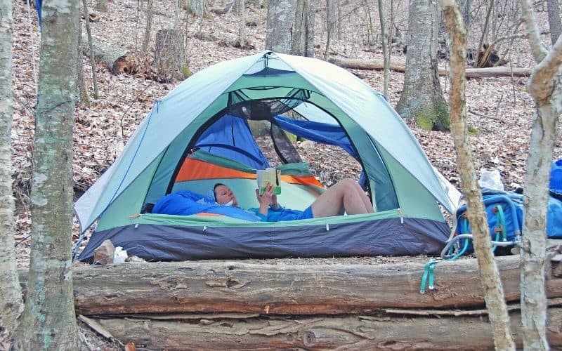 relaxing in backpacking tent