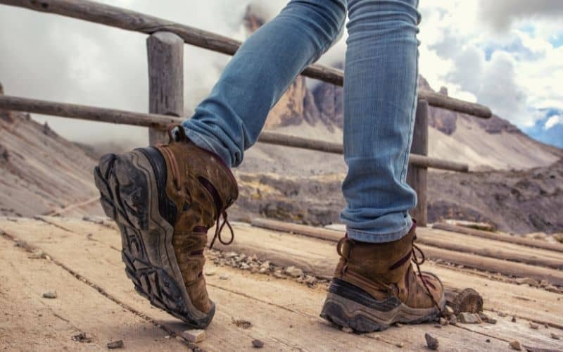 Hiker walking and showing tread on hiking boots