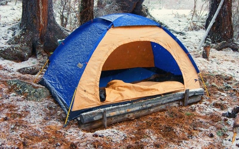 Tent pitched on frosty ground