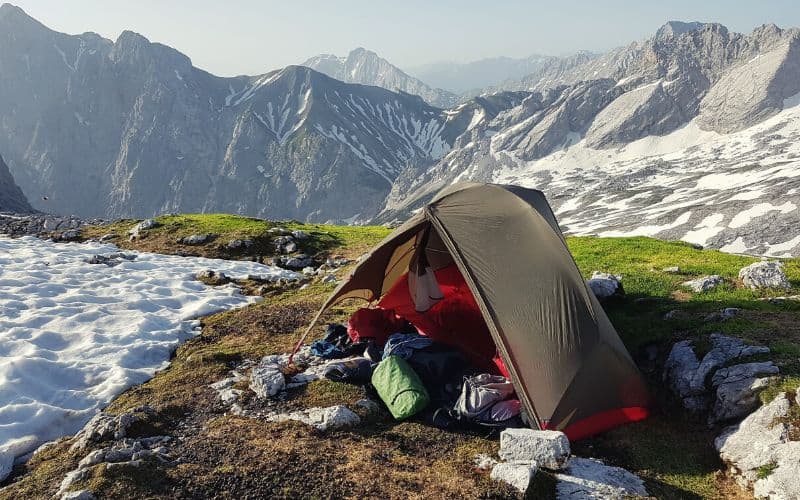 Backpacking tent pitched in the Alps