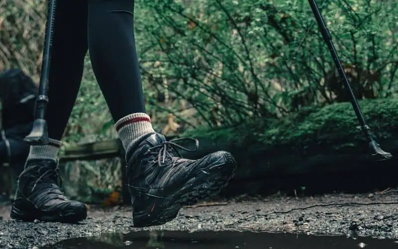 Hiker walking in leggings and hiking boots