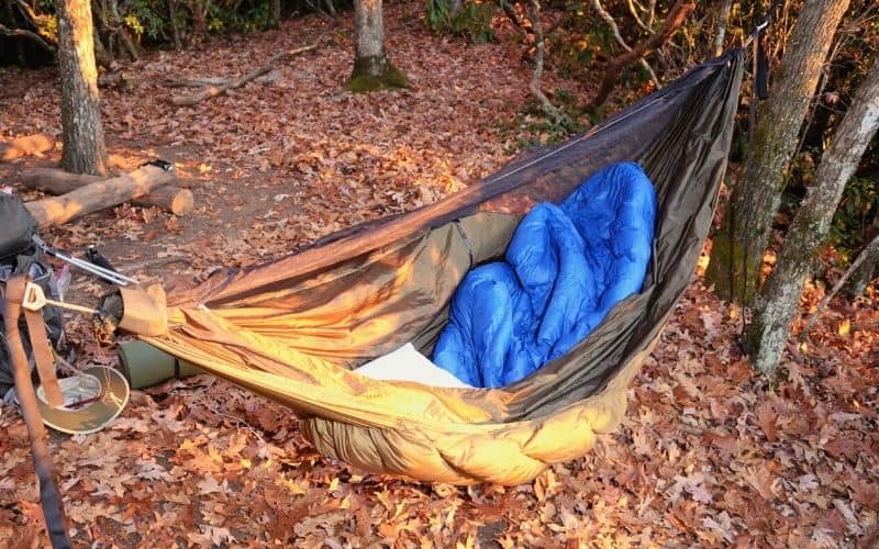 Hammock with sleeping bag and hammock underquilt inside