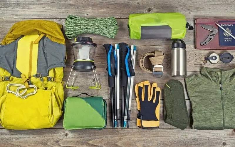 Backpacking gear laid out over a table