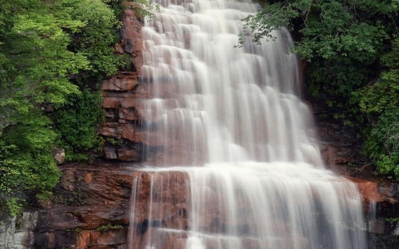 Fall Creek Falls waterfall cascading over red bedrock