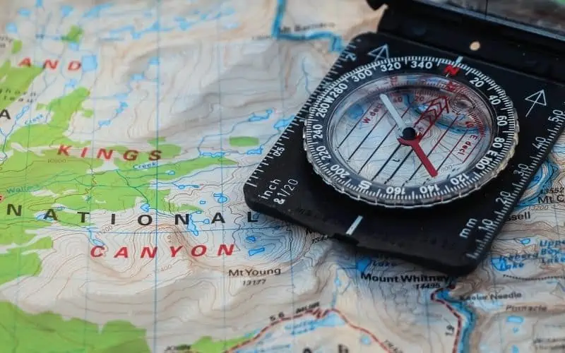 Close up of a map of the John Muir Trail and compass