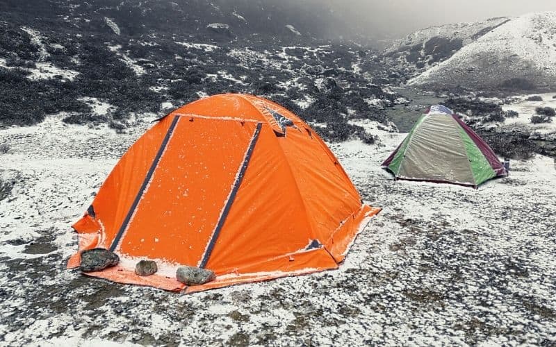 Four season tent with tent flaps pitched in the snow