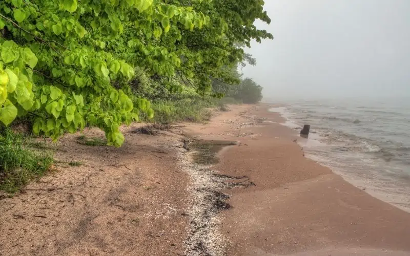 The sandy shore of Harrington Beach lies on Lake Michigan