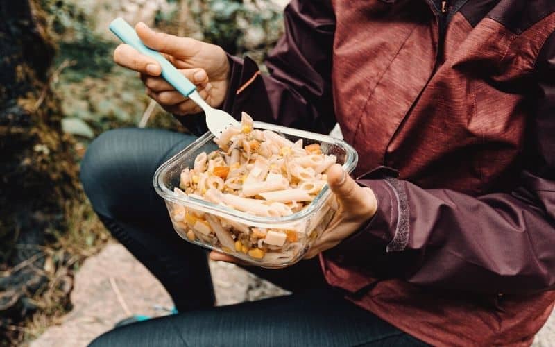 Hiker eating pasta salad