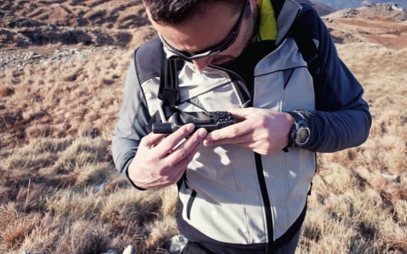 Hiker using a GPS unit
