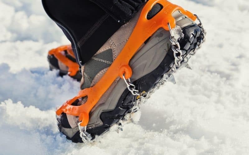 Microspikes attached to the soles of hiking boots