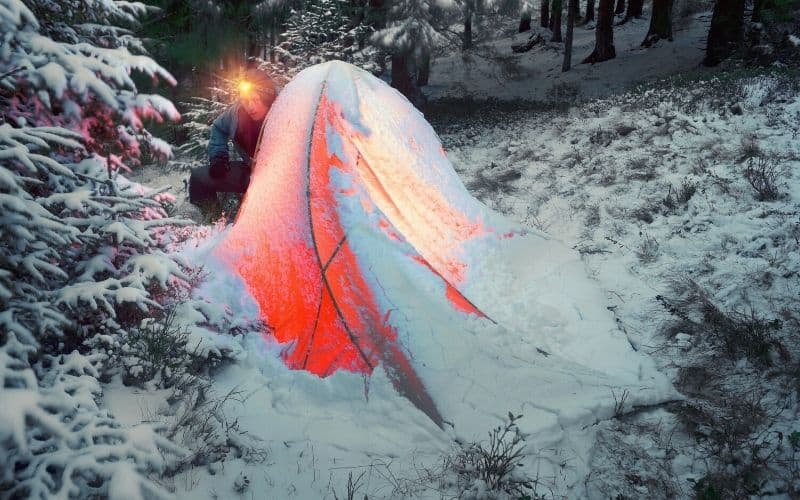 Snow weighing down on a pitched tent