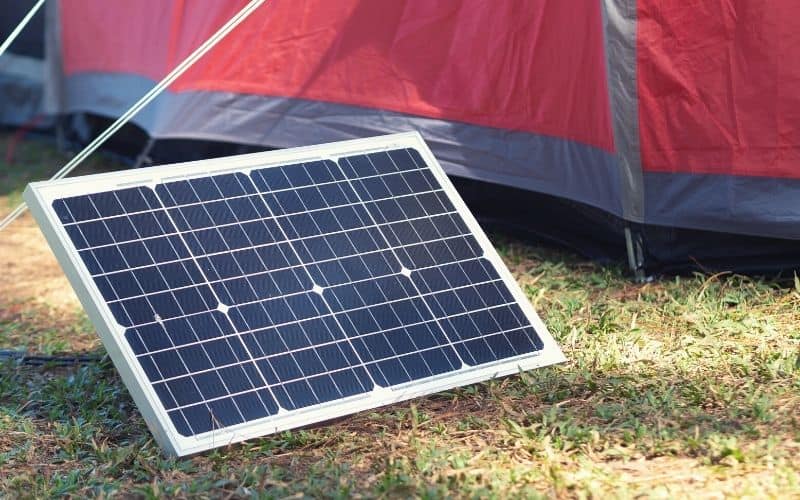 Solar panel outside a tent used to run a generator