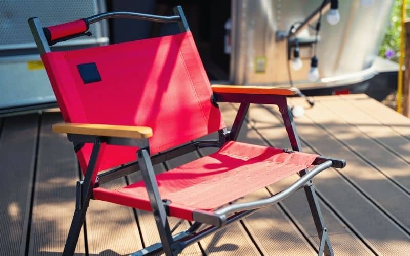 Sturdy camping chair in front of RV