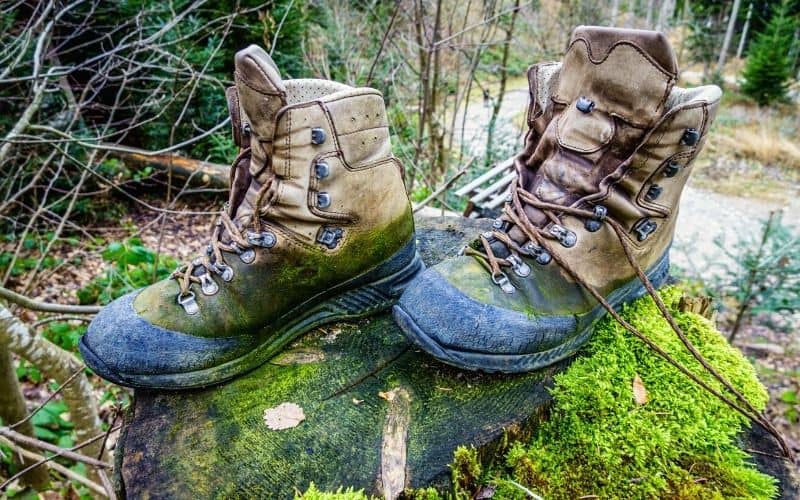 Old hiking boots covered in mud