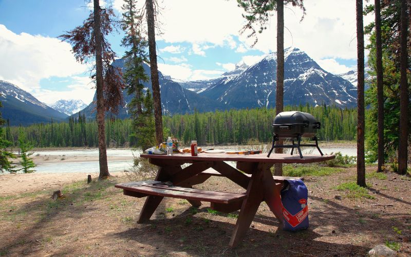 Picnic table in front of mountains