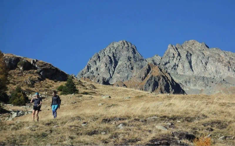 Two women trekking on terrain