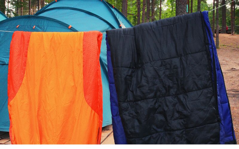dog sleeping bags hanging on a line