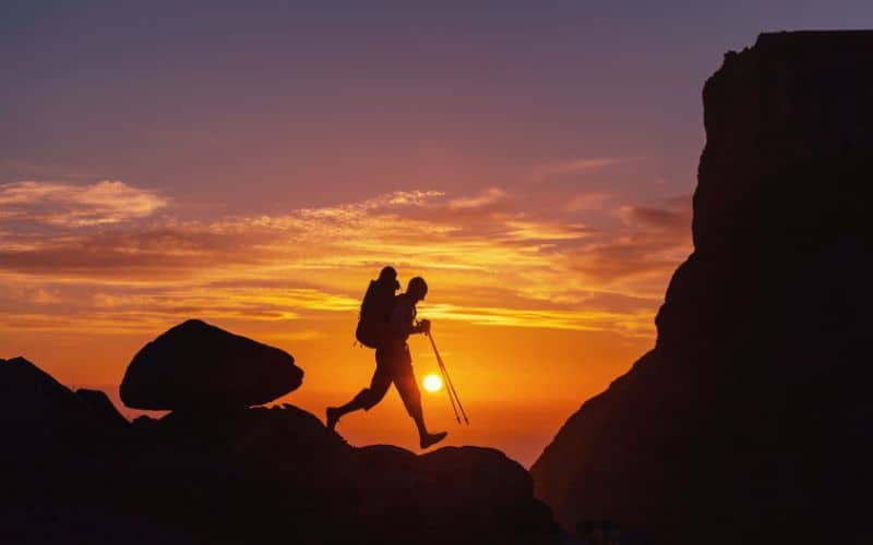 Silhouette of hiker against a sunset