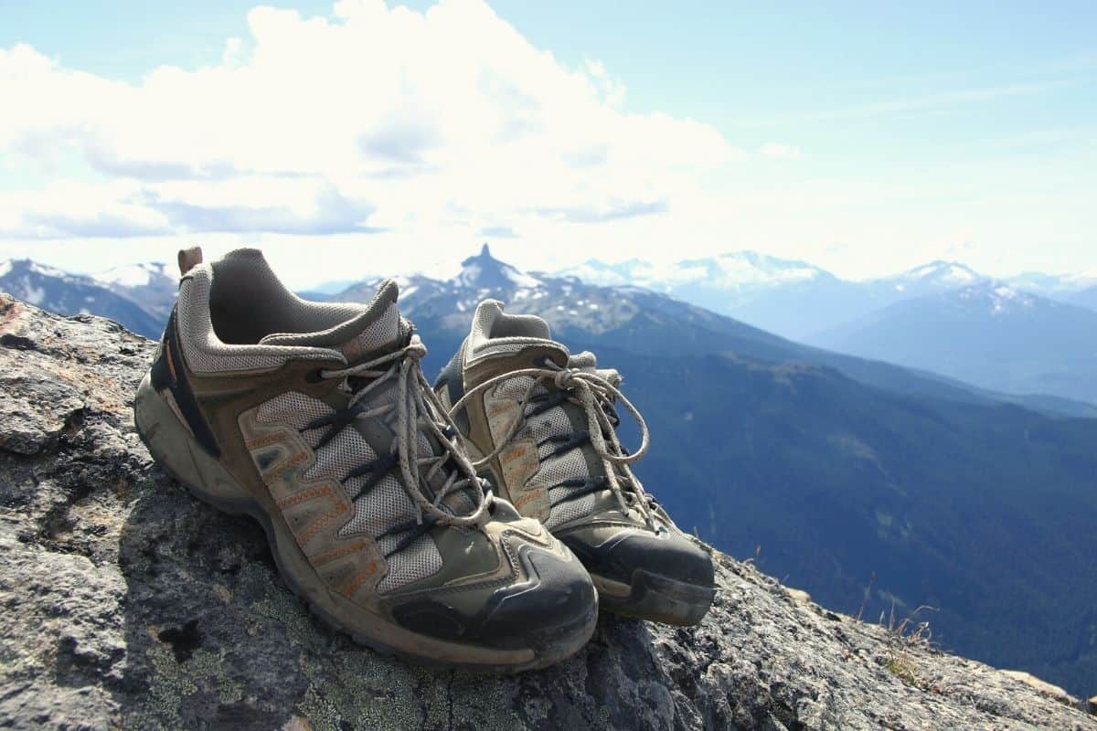 Hiking shoes sitting in front of mountain landscape